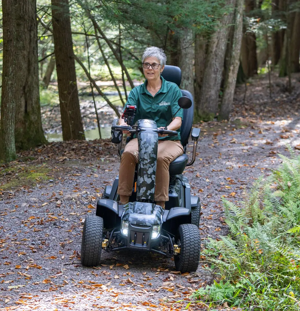 Pride Wrangler mobility scooter on a woodland trail