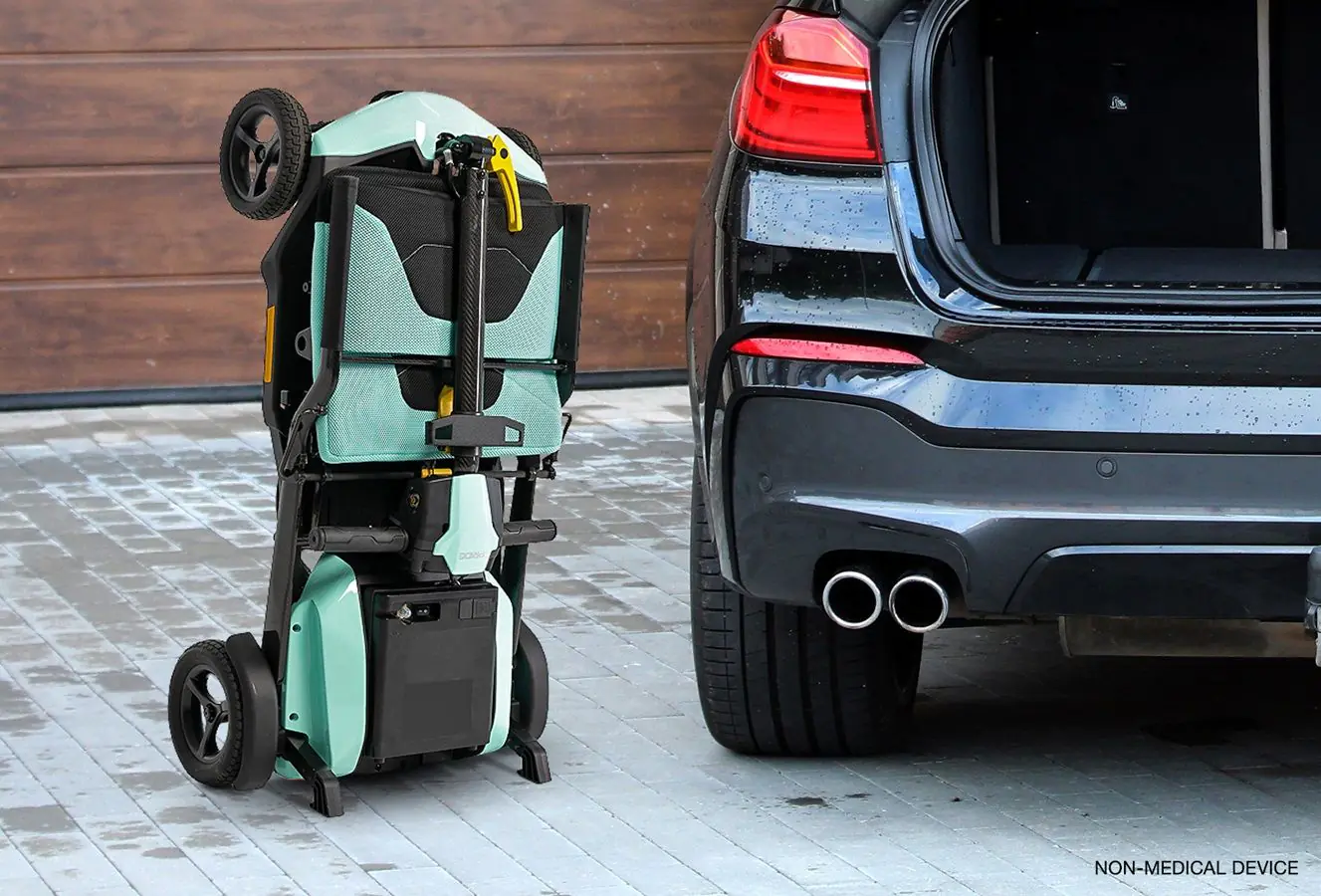 Folded Pride travel mobility scooter standing upright