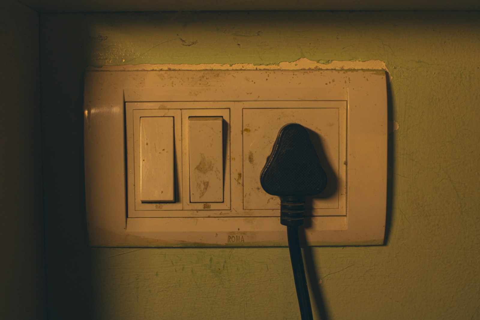 Electrical outlet with a black plug inserted