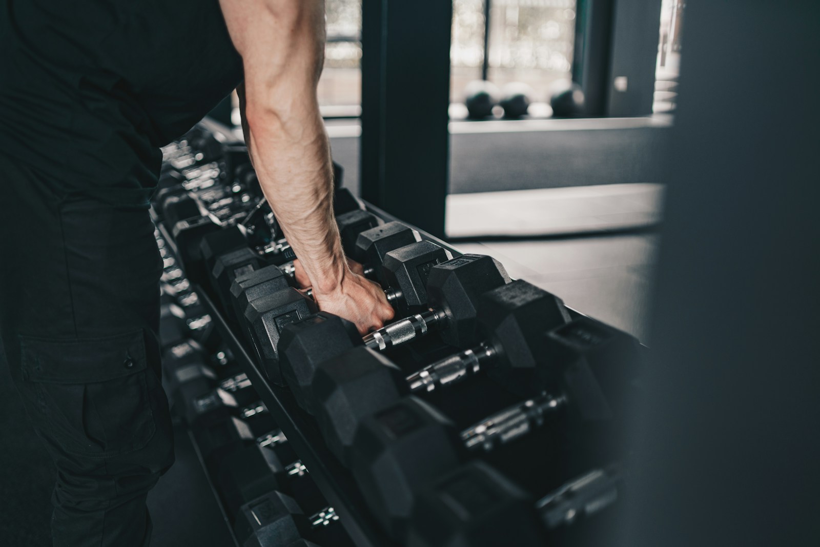 A man using commercial gym equipment in a fitness facility