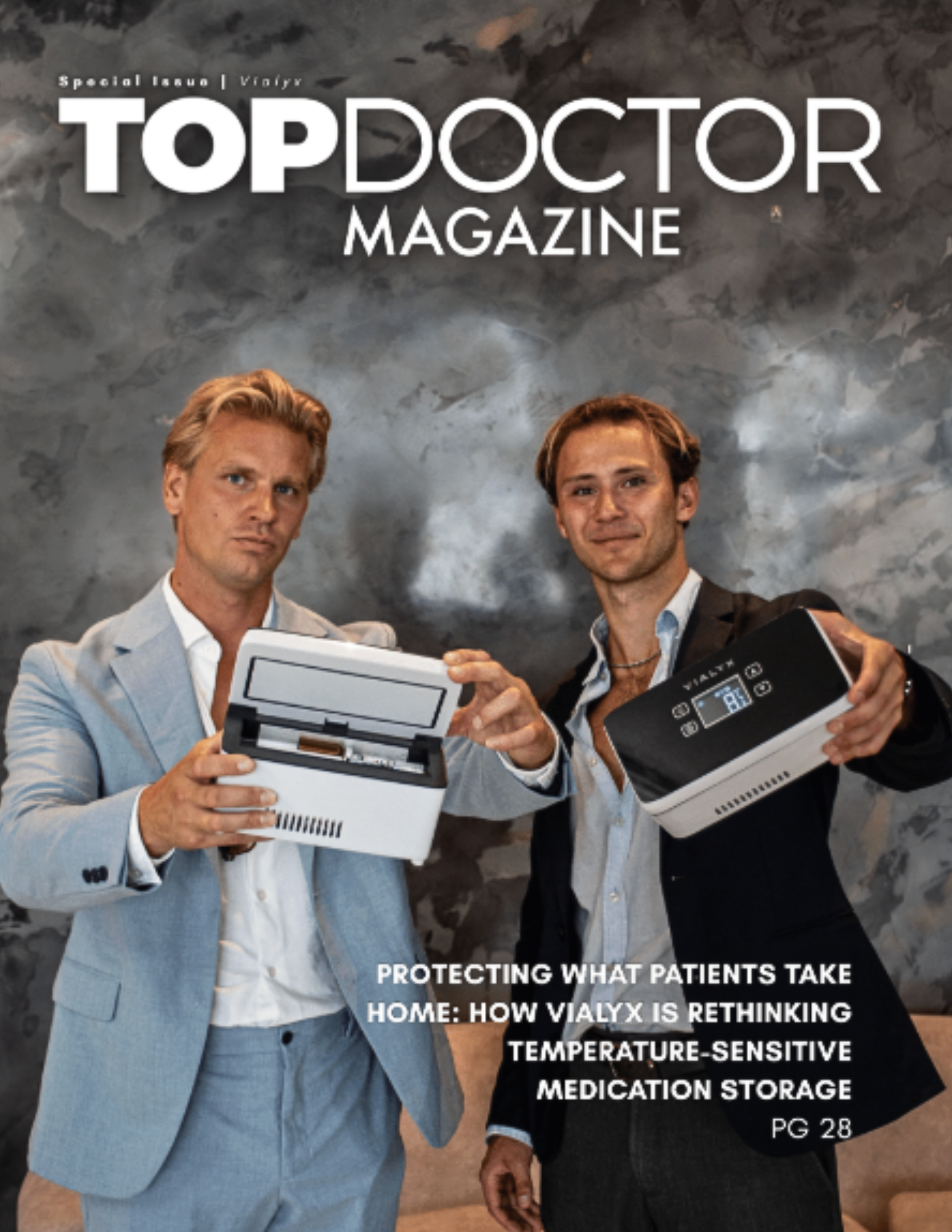 TopDoctor Magazine special issue cover for Vialyx, showing two men's portraits over a smoky gray background